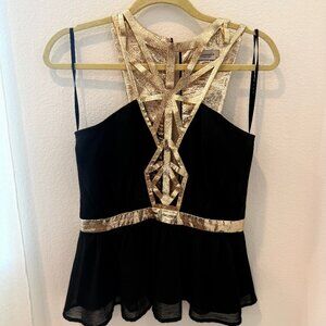 Beautiful, sexy top with gold design. Statement piece!